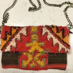 Antique and vintage Moroccan rug clutch handbag with long chain